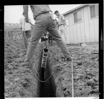 Under-grounding electric cable in a new housing tract