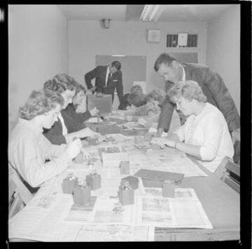 People making table cigarette lighters & pen holders