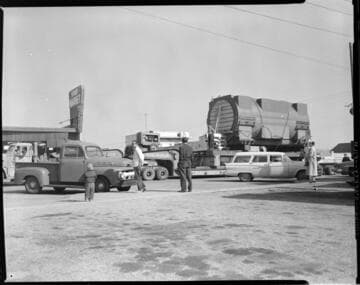 Hauling large General Electric generating unit through El Segundo on way to new power plant