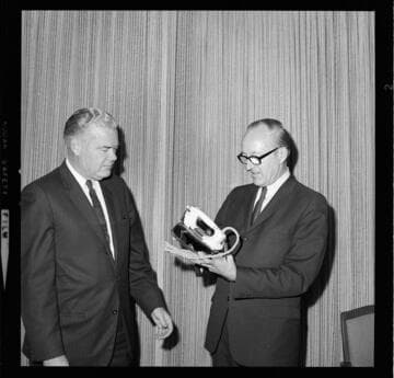 Men with a GE Steam Iron