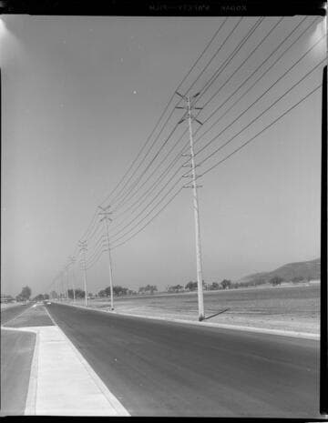 Double-circuit transmission line corridor with "bird cage" insulators on single pole construction - Bluff Cove Substation