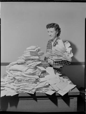 Envelope stack of "What I See Behind My Electric Bill" contest replies and Lillian Presnell