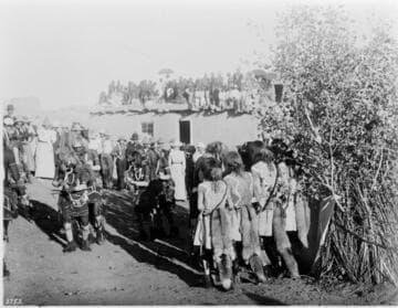 Priests with snakes in mouth. Hopi Snake Dance