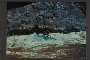 Jack Brennan driving boat through Cisco Bend; Westwater Canyon