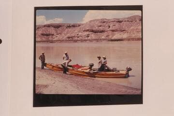 Harris-Brennan party on the Green River.  Brennan is at left and Harris is in red cap