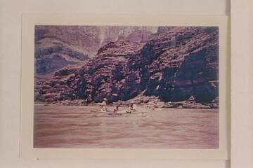 Pres Walker at the oars of the "Mexican Hat II", Ed Olsen stands forward, Marston on the after deck; Grand Canyon traverse