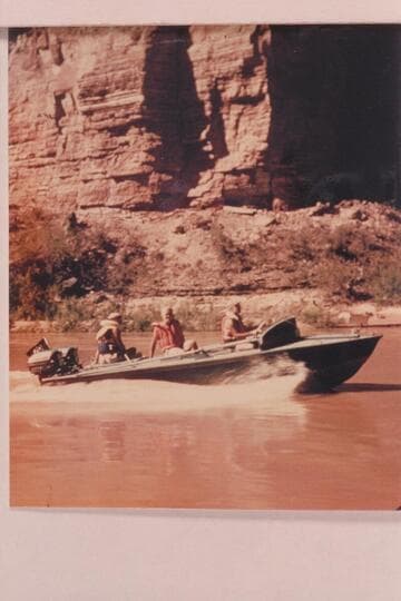 The "BOOTOO" cruising near Deer Creek; Masland, Eisaman and Marston at the wheel
