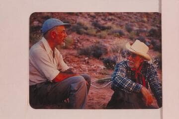 Dock Marston and Archeyes Masland in a heavy discussion over the difference between a bridge and an arch; Navajo Canyon