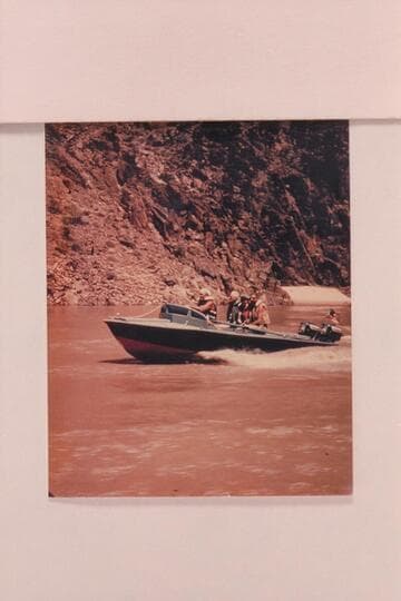 The "RATTLESNAKE" cruising in the Grand Canyon between Whitmore Wash and Lake Mead.  Rod Sanderson is piloting, in back of him sits Joe Desloge, Lois Sanderson and Hugh Cutler