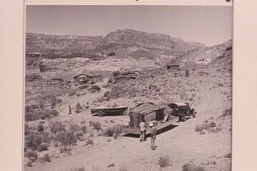 Boats and motors arriving at Lees Ferry for the start of the Marble-Grand Canyon traverse of 1954, June