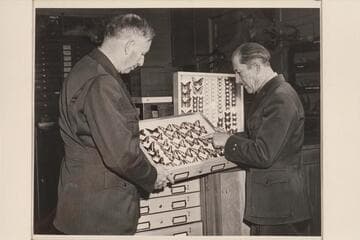 Harold Bryant gets a briefing from Louis Schellback
