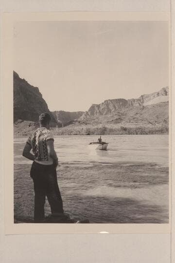 Edward Hudson watches his father, Ed Hudson, bring the "Esmeralda" [II] in from its first test run at Lees Ferry