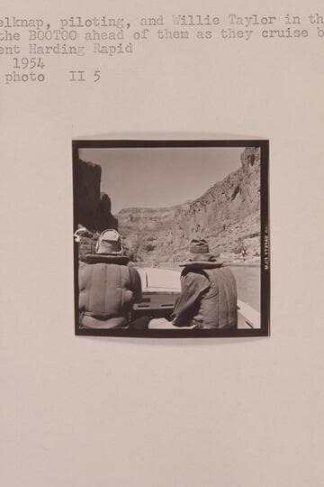 Bill Belknap, piloting, and Willie Taylor in the "Cactus" watch the "Bootoo" ahead of them as they cruise below President Harding Rapid