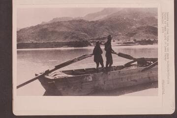 Bessie and Glen Hyde in the scow "Rain-in-the-Face."  At Lees Ferry