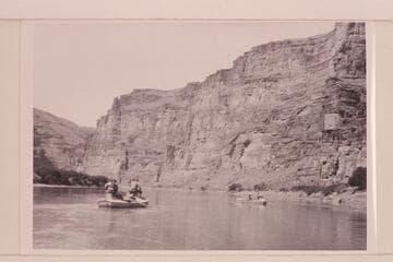 USGS survey trip from Green River, Wyoming, to Green River, Utah. A feature of the boat operation was the boxes fastened to the hatch covers of the boat operated by Loper. These provided the seats for Woolley and Trimble. Four miles below Wash