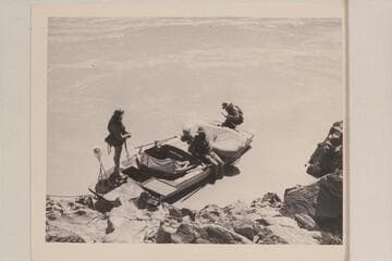 The "Esmeralda II" at camp at Mile 20.  Marston; Robinson; Hudson.  Her flimsy shield had already given way in the rapid at Boulder Narrows