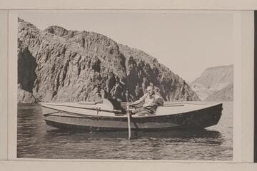 Buzz Holmstrom posing in his skiff the "Julius F", just above Hoover Dam