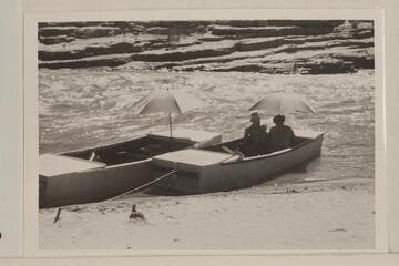 The Frost punts; San Juan River at Mexican Hat.  Skipper Frost faces the camera and Robert L. Gates has back to the camera.  Second trip of the season