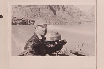 Bering Monroe in his motorboat in Glen Canyon.  Bering cruised in Glen Canyon between 1944 and 1949