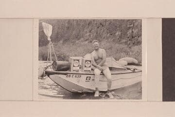 "Ed" Hudson posed on his motorboat "Esmeralda"; Bright Angel Creek
