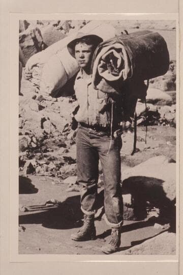 Leigh B. Lint loaded for portage of dunnage in Cataract Canyon during survey by USGS in 1921, Sep