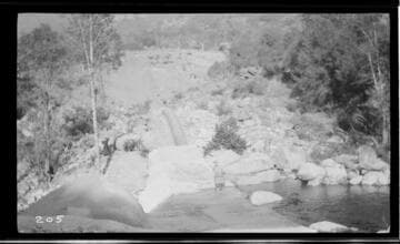 A siphon going through a small dam at Kaweah #3 Hydro Plant