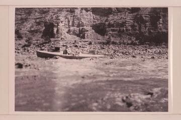 Loper in a rapid. USGS survey trip from Green River, Wyoming, to Green River, Utah. Note the boxes on the hatch covers which were seats for Woolley and Trimble in the fashion of Powell
